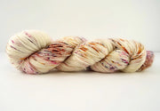 Multicolored skein of yarn on a white background