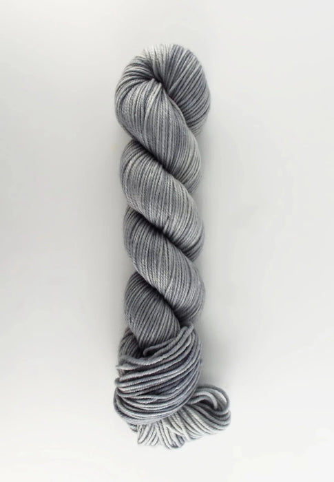 Gray skein of yarn on a white background