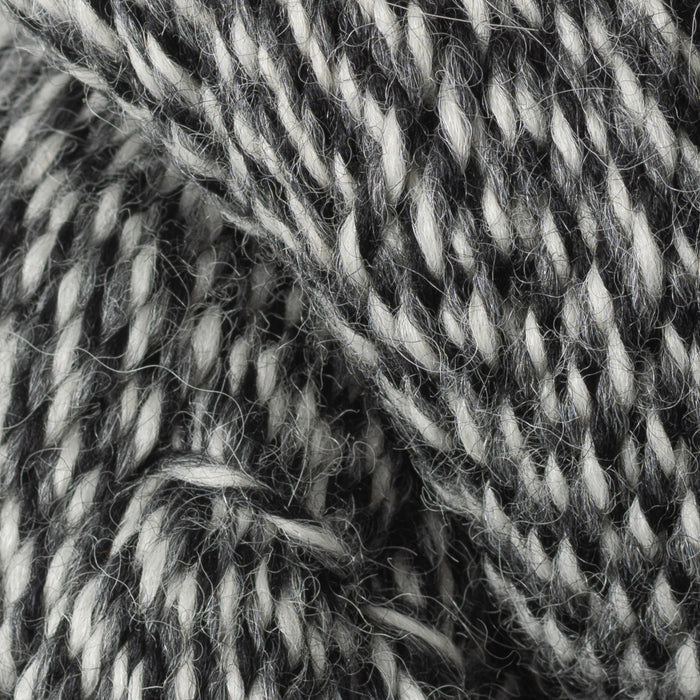 Close-up of gray and white yarn strands