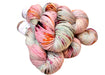 Multicolored skein of yarn on a white background