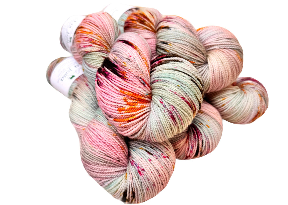 Multicolored skein of yarn on a white background