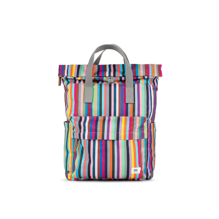 Multicolored striped backpack with gray handle on a white background
