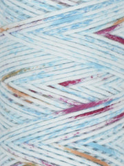 Close-up of multicolored yarn with blue, pink, and brown tones.