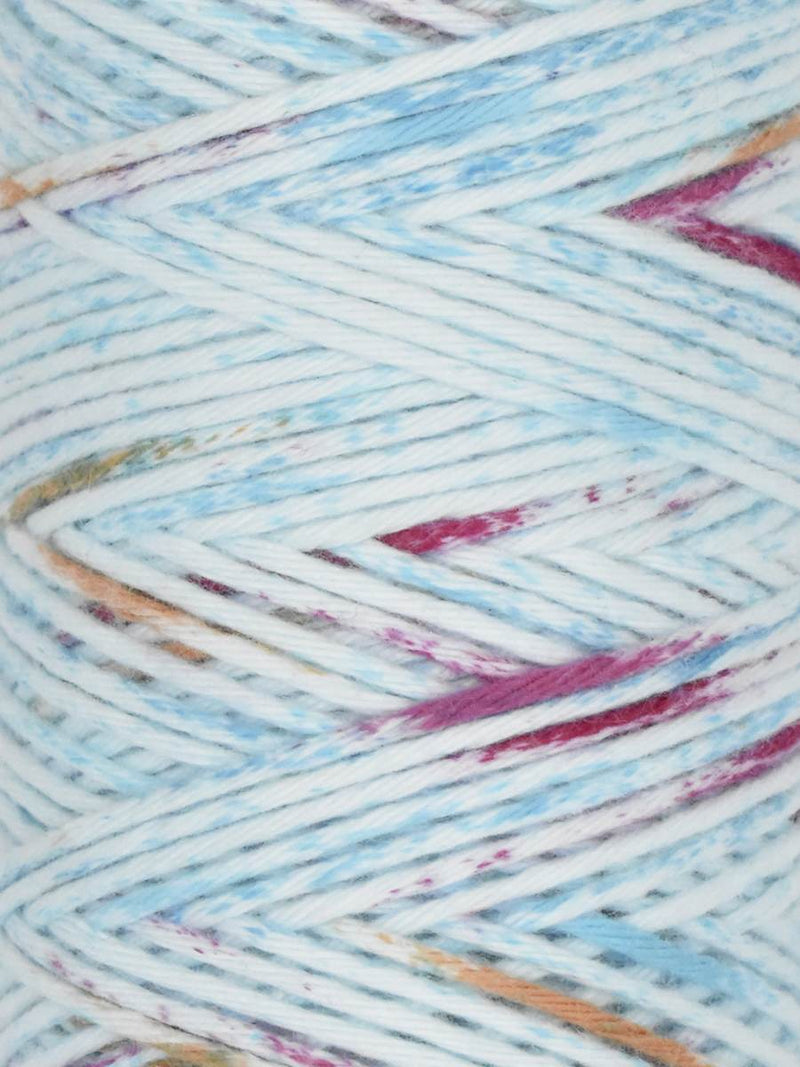 Close-up of multicolored yarn with blue, pink, and brown tones.