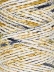 Close-up of multicolored yarn with yellow, blue, and white strands.
