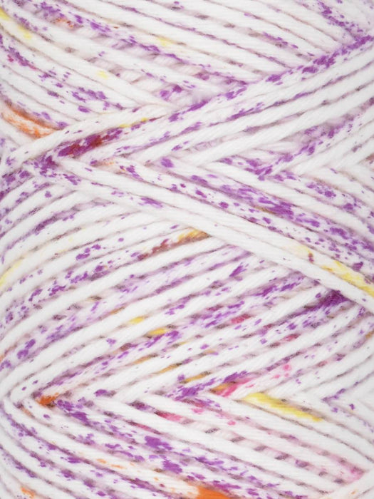 Close-up of a ball of yarn with purple and white patterns