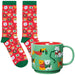 Set of Christmas-themed socks and mug with dog illustrations on a white background