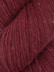 Close-up of a ball of dark red yarn