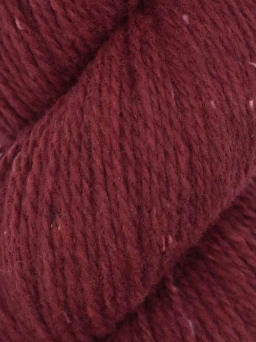 Close-up of a ball of dark red yarn