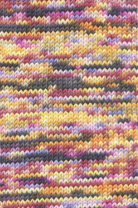 Close-up of multicolored knitted fabric with a textured pattern.
