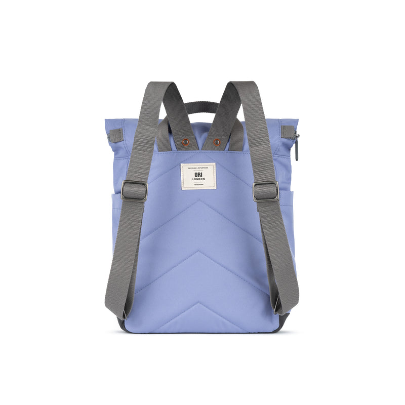 Blue backpack with gray straps on a white background