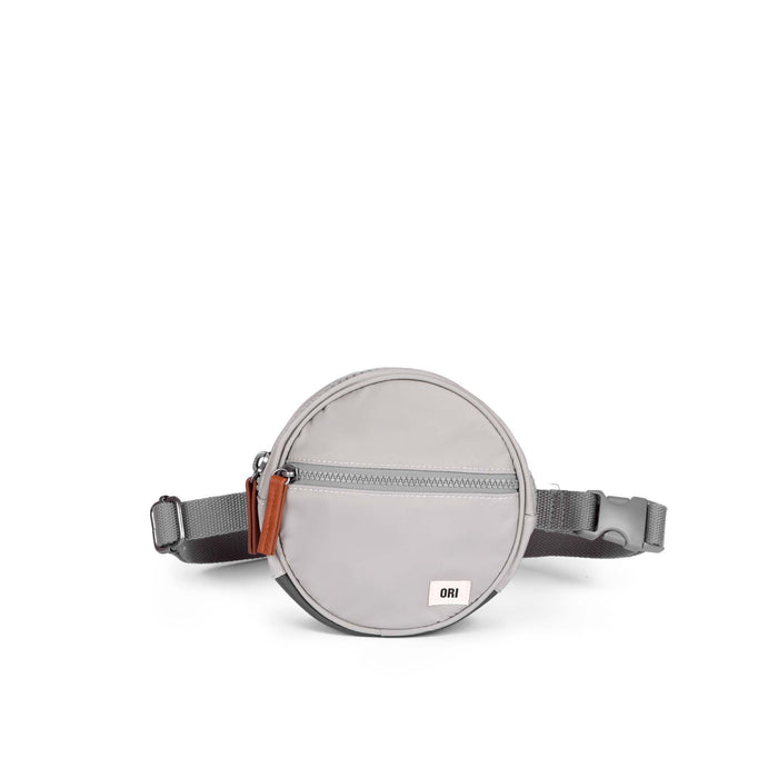 Round gray waist bag with a strap on a white background