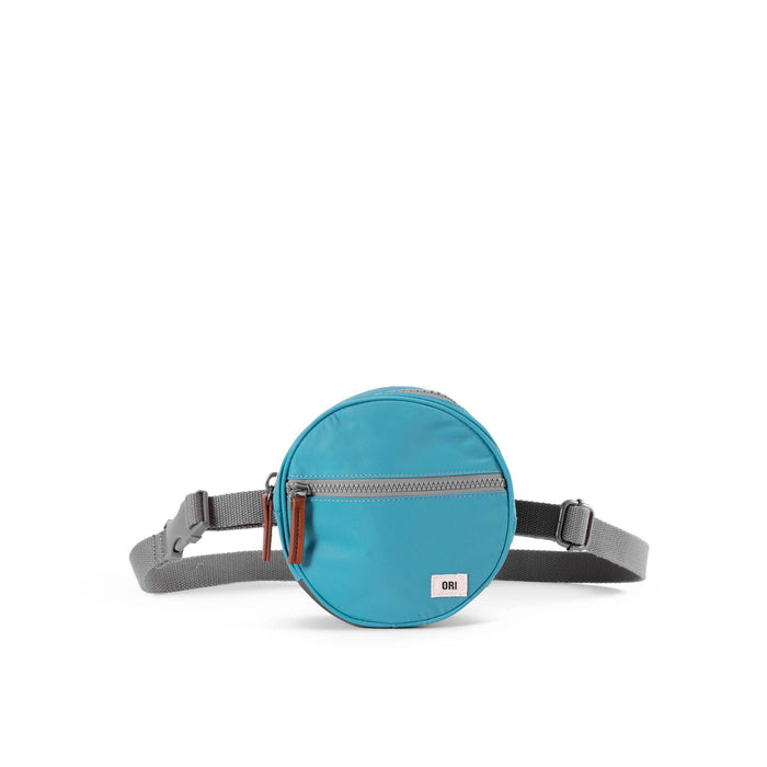 Blue round waist bag with gray strap on a white background
