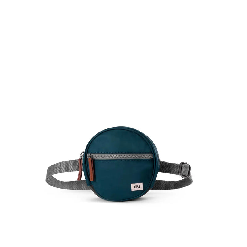 Round blue waist bag with a strap on a white background
