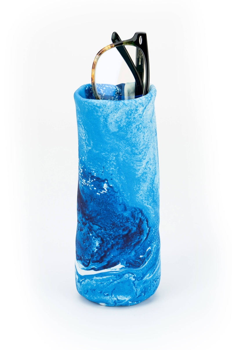 Blue cylindrical container with sunglasses on a white background