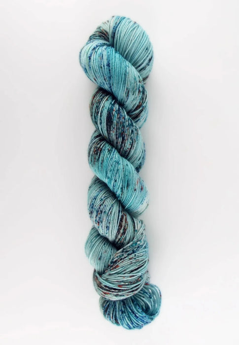 Blue and gray skein of yarn on a white background