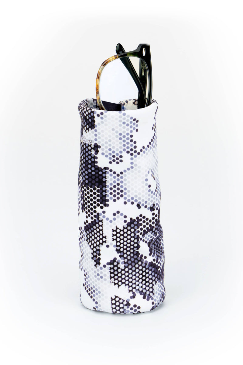 Snakeskin-patterned wine bottle holder with a black hair clip on a white background