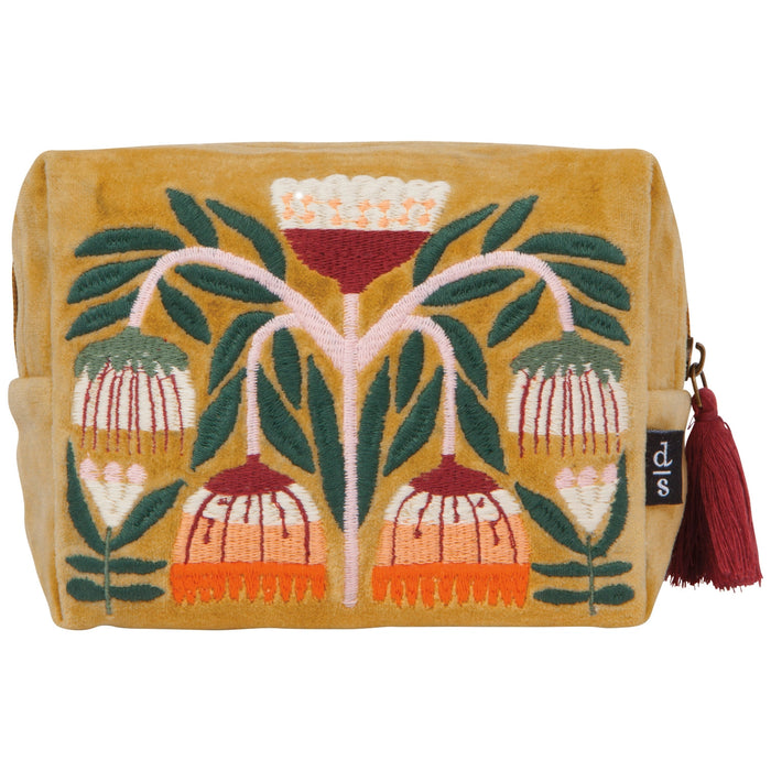 Decorative pouch with floral design and tassel on a white background
