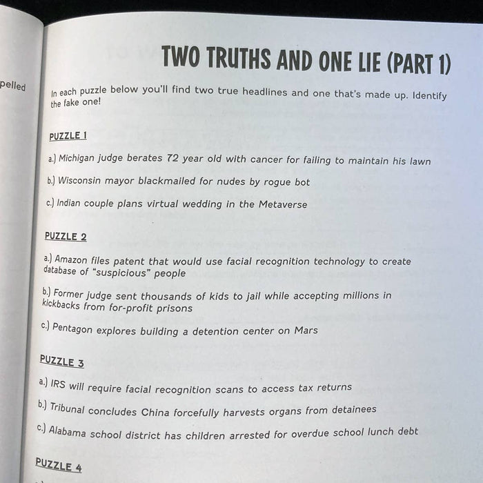 Open book with a puzzle titled 'Two Truths and One Lie' on a black background