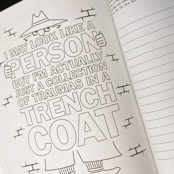 Open notebook with a humorous text and doodles on a white background