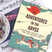 Book titled 'Adventures in the Abyss' on a newspaper background
