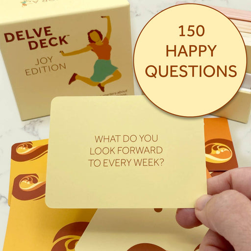 Delve Deck Joy Edition card game with a question card held by a hand, featuring '150 Happy Questions' text.
