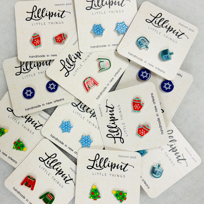 Collection of Lilliput Little Things earrings on branded cards.