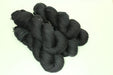Black yarn on a white background