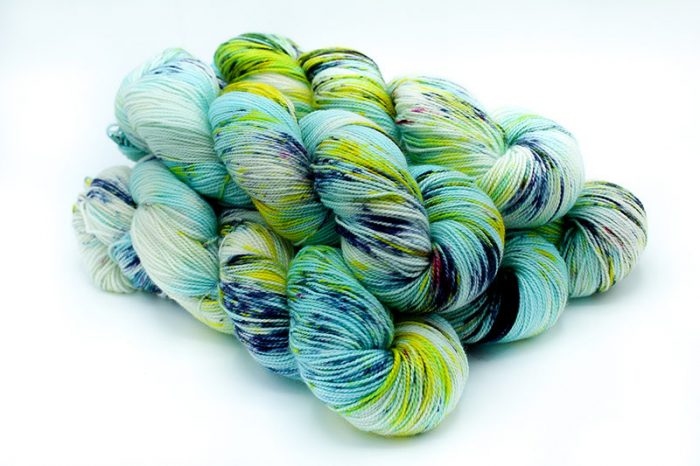 multicolor blue yarn on white background