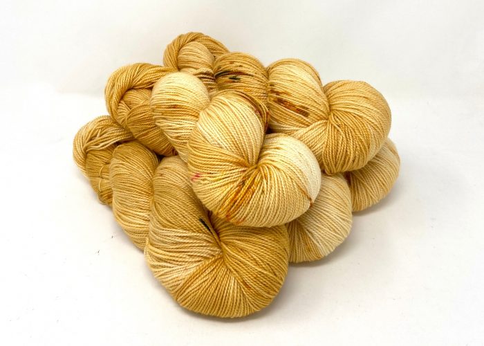 Gold yarn on a white background