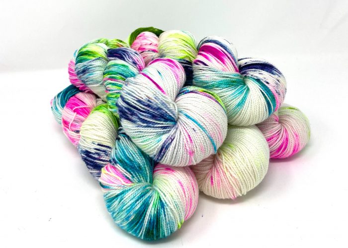 Multicolored yarn skeins on a white background