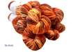 Multicolored yarn skeins with 'Be Bold' text on a white background