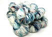 Multicolored yarn skeins on a white background