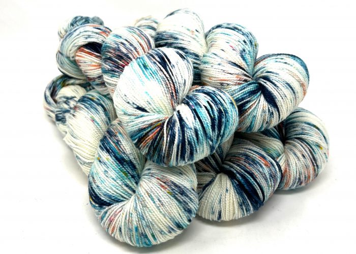 Multicolored yarn skeins on a white background