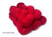 Red yarn on a white background with the words "Burmese Ruby"
