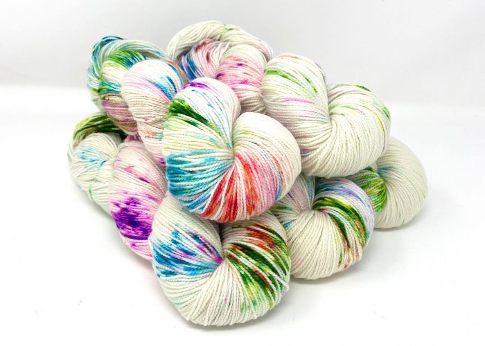 Multicolored yarn skeins on a white background