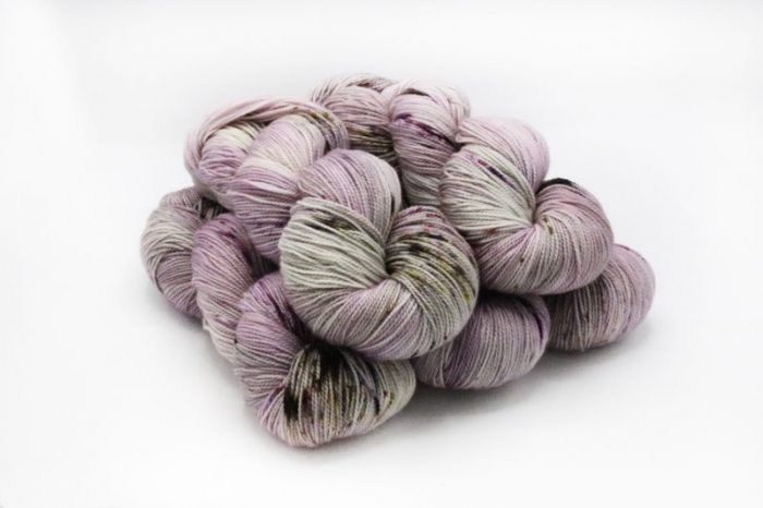 Multicolored skein of yarn on a white background