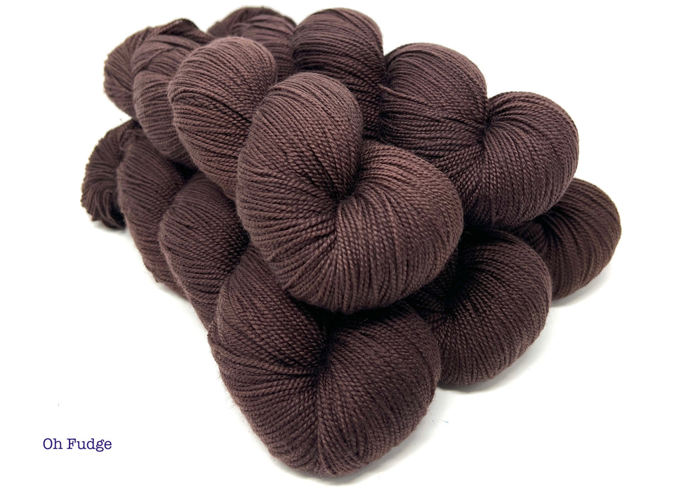 Brown yarn skeins on a white background