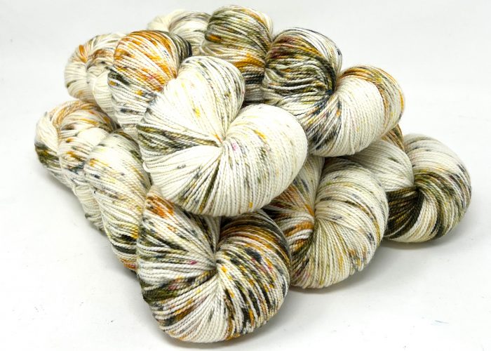 Multicolored yarn skeins on a white background