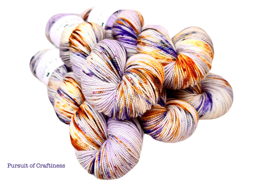 Multicolored yarn skeins on a white background