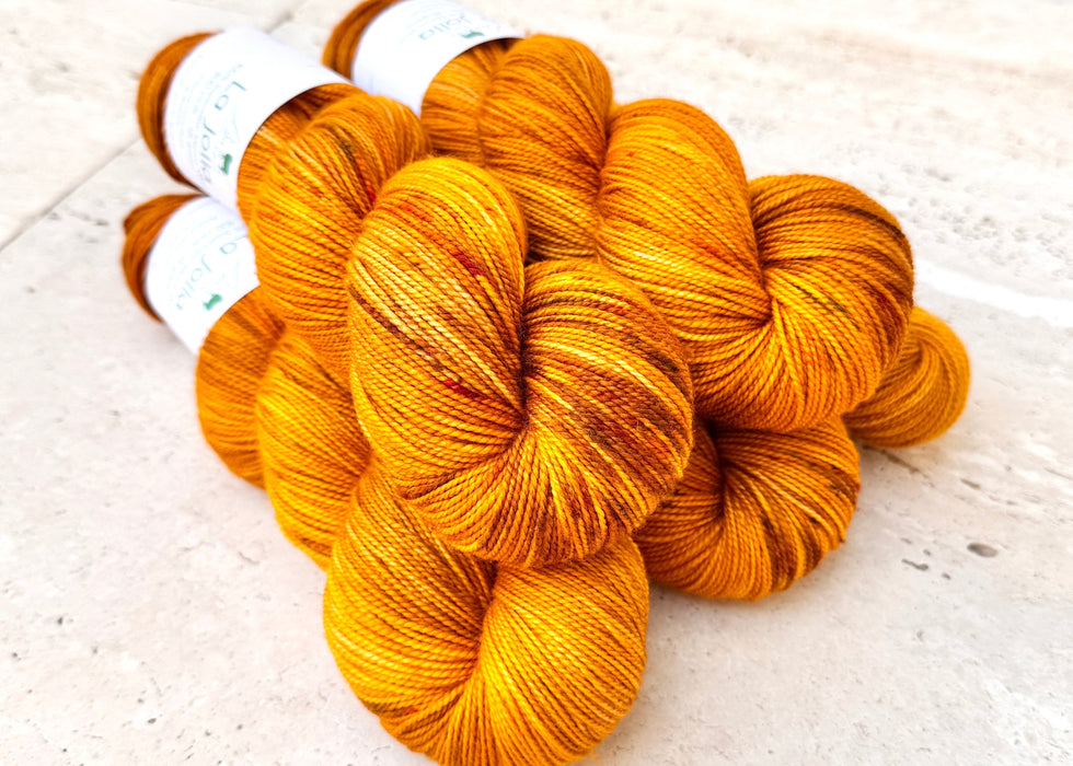 Bunch of orange yarn on a light background