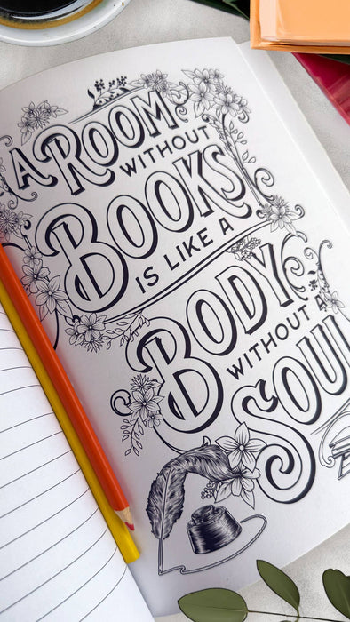 Book with decorative text and illustrations on a table