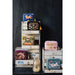 Decorative wall shelf with various colorful pouches against a dark background