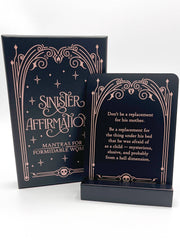 Two black cards with decorative gold text on a white background