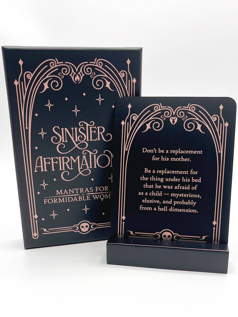 Two black cards with decorative gold text on a white background