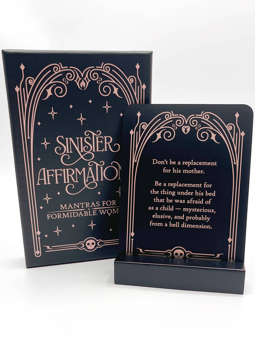 Two black cards with decorative gold text on a white background