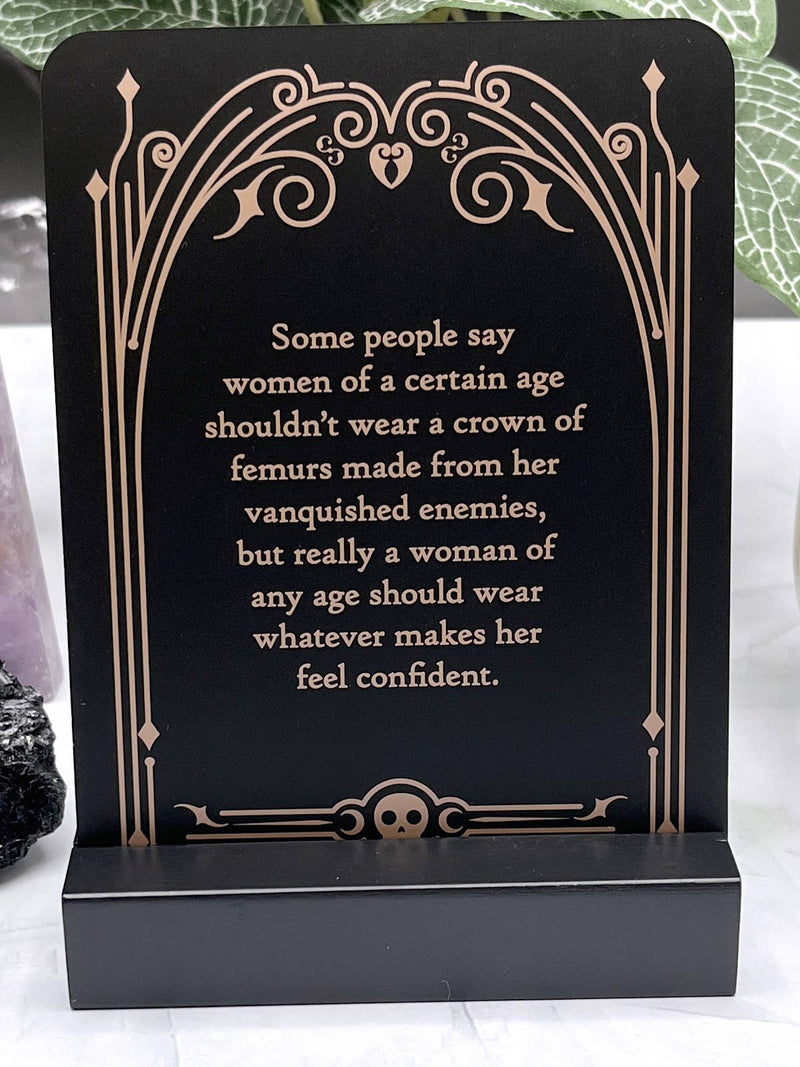 Decorative plaque with a motivational quote on a black background