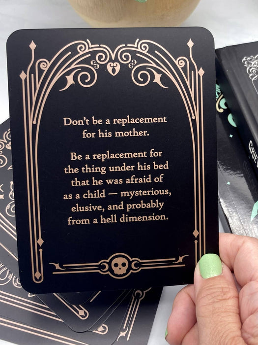 Card with a humorous message held by a hand, surrounded by other cards.