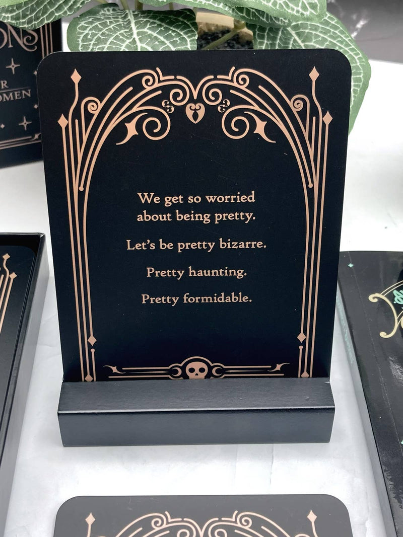 Decorative card with a quote on a black stand