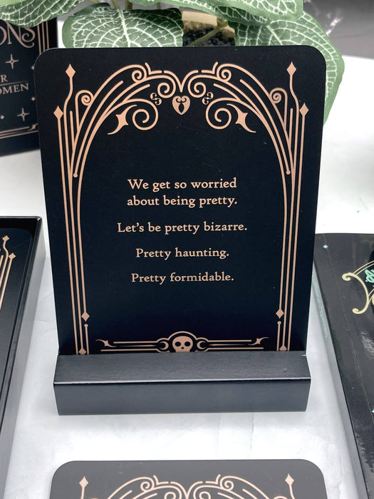 Decorative card with a quote on a black stand